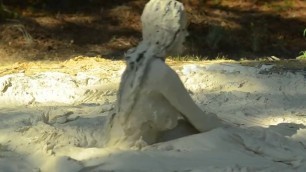 Girl in Bikini having Fun in Mud