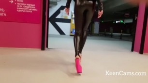 Sexy Brunette in Walking in Leather Leggins and High Heels
