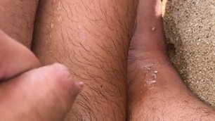 Pissing and cumming on beach