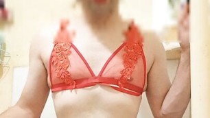 Boy wearing sexy red women's lingerie